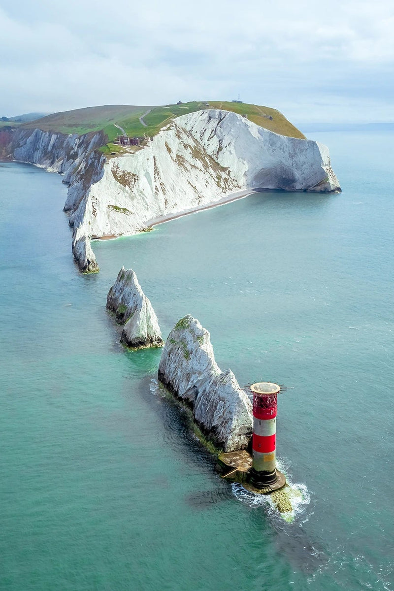 The Needles Lighthouse on a rocky outcrop at the end of the Isle of Wight